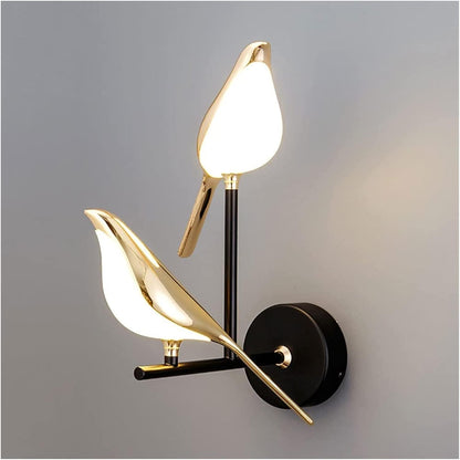 Illuminate your outdoor space with the Bird LED Wall Sconce in Gold. Enhance your exterior with stylish outdoor wall lights, sconces, and decorative elements.